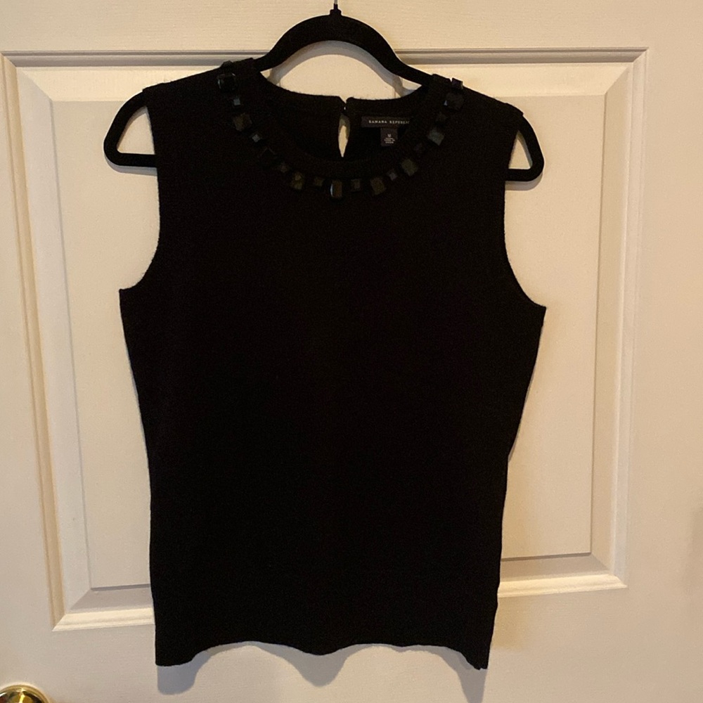 Never worn black sleeveless top with black beads around neck.